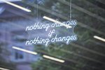 The words "Nothing changes if nothing changes" hang in the window of the ICAT showroom.